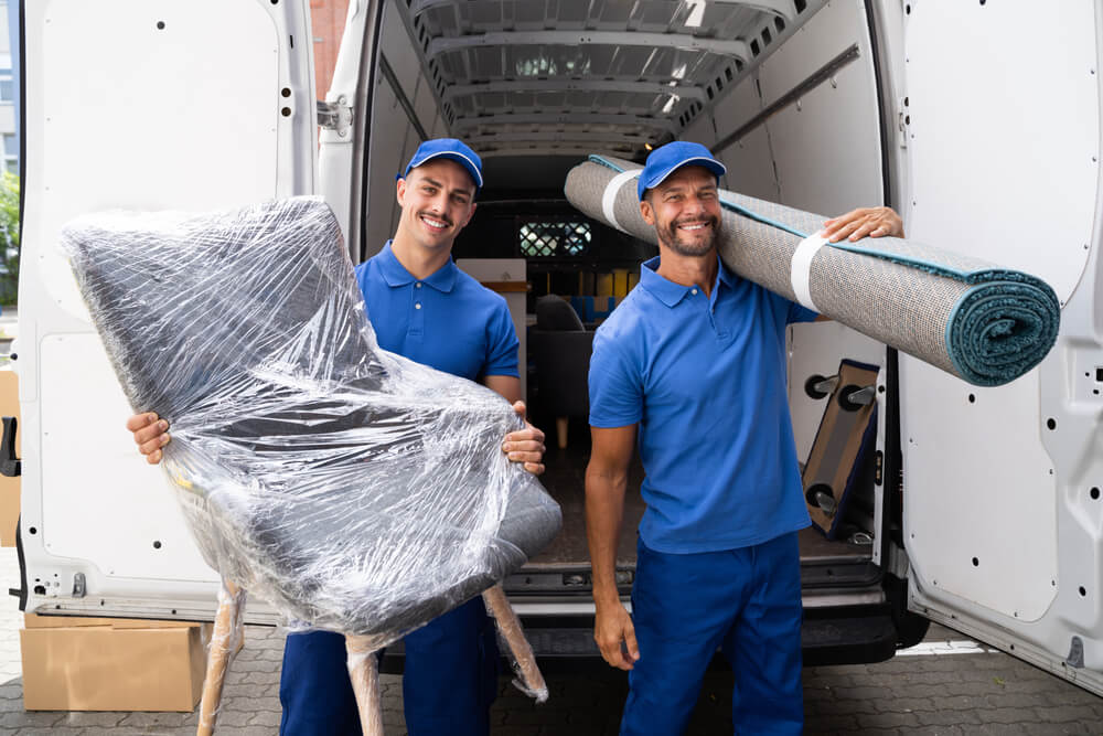 Movers Carrying Heavy Furniture Carefully